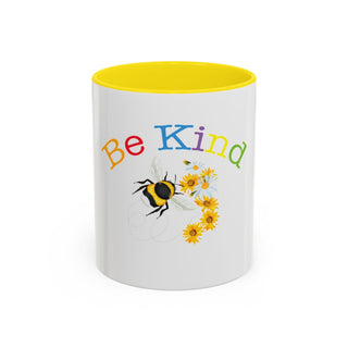 Be Kind Signature Collection 11 oz white mug with yellow interior, colorful lettering, bumblebee and yellow floral design