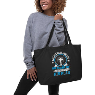 Faith Is Trusting God Black Front Large Eco Tote Bag with woman holding bag.