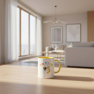 Mug with 'Be Kind' text on a wooden table in a bright living room.