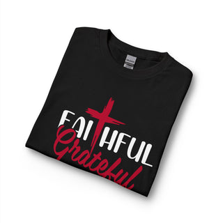 Suggestion


A folded black t-shirt with a red and white graphic print reading 'FAITHFUL Grateful' with a red cross, shown on a white background.